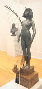 The Singer by Edward Onslow Ford - front left in glass case