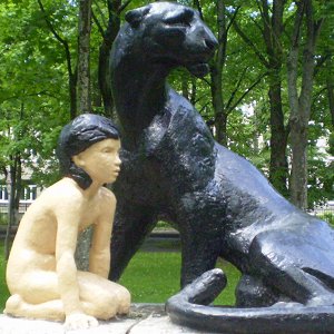 Statue of Mowgli, Priozersk, Russia - Front right, big and blurry with pale Mowgli